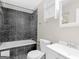 Bathroom features tile shower, built-in cabinet, and modern fixtures at 1508 Bonanza Church Rd, Jonesboro, GA 30238