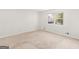 Bright, neutral bedroom with carpeted floor and a large window at 1508 Bonanza Church Rd, Jonesboro, GA 30238
