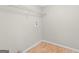 Walk-in closet features wire shelving, light hardwood floors, and wall outlet at 1508 Bonanza Church Rd, Jonesboro, GA 30238