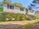 Charming two-story home with landscaped front yard and stone accent wall at 1508 Bonanza Church Rd, Jonesboro, GA 30238