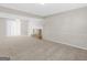Open living room features a fireplace, carpet, and ceiling fan at 1508 Bonanza Church Rd, Jonesboro, GA 30238