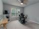 Comfortable bedroom with a ceiling fan and a window, plus a desk for work at 12711 Simmons Rd, Hampton, GA 30228