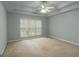 Spacious bedroom with a large window offering plenty of natural light and a ceiling fan at 12711 Simmons Rd, Hampton, GA 30228