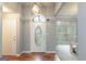 Welcoming entryway featuring hardwood floors and a decorative front door at 12711 Simmons Rd, Hampton, GA 30228