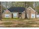 Inviting brick home with a classic design and covered front porch at 12711 Simmons Rd, Hampton, GA 30228