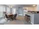 Eat-in kitchen featuring wood bar and matching chairs at 12711 Simmons Rd, Hampton, GA 30228