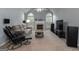 Cozy living room with fireplace, neutral walls, and comfortable seating at 12711 Simmons Rd, Hampton, GA 30228