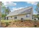 Exterior view of house featuring a well-maintained lawn and natural landscaping at 2014 Big Cypress Ln, Locust Grove, GA 30248