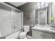 Updated bathroom featuring shower over tub, toilet, and vanity with solid surface countertop at 2014 Big Cypress Ln, Locust Grove, GA 30248