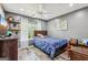 Bedroom with hardwood style flooring, a ceiling fan, and natural light from the window at 2014 Big Cypress Ln, Locust Grove, GA 30248