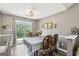 Dining room with sliding glass door to back yard and modern lighting fixture at 2014 Big Cypress Ln, Locust Grove, GA 30248