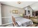 Dining room with sliding glass door to back yard and modern lighting fixture at 2014 Big Cypress Ln, Locust Grove, GA 30248