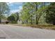Charming home with a two-car garage, dormer windows, and mature trees on a well-maintained property at 2014 Big Cypress Ln, Locust Grove, GA 30248