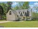 Charming home with a two-car garage, dormer windows, and a well-maintained lawn and landscaping at 2014 Big Cypress Ln, Locust Grove, GA 30248