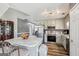 Updated kitchen featuring stainless appliances, granite countertops, and hardwood style flooring at 2014 Big Cypress Ln, Locust Grove, GA 30248