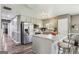 Bright kitchen with stainless steel appliances, a center island, and modern lighting at 2014 Big Cypress Ln, Locust Grove, GA 30248