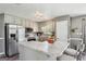 Updated kitchen featuring stainless appliances, granite countertops, and hardwood style flooring at 2014 Big Cypress Ln, Locust Grove, GA 30248