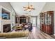 Bright living room with vaulted ceilings, a fireplace, large windows, and stylish decor at 2014 Big Cypress Ln, Locust Grove, GA 30248