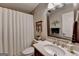 Bathroom featuring neutral colors, shower with white curtain, and a white marbled sink at 3230 Riverhill Ct, Cumming, GA 30041