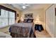 Cozy bedroom featuring a ceiling fan, natural light and decorative accents at 3230 Riverhill Ct, Cumming, GA 30041