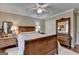Bedroom features neutral walls, hardwood floors, and a decorative wood bed frame at 3230 Riverhill Ct, Cumming, GA 30041