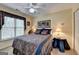 Comfortable bedroom featuring a ceiling fan, natural light and decorative accents at 3230 Riverhill Ct, Cumming, GA 30041