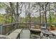 Relaxing outdoor deck with lounge chairs overlooking a peaceful pond, perfect for enjoying nature and fresh air at 3230 Riverhill Ct, Cumming, GA 30041