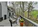 Cozy deck overlooking a pond with comfortable seating and serene nature views. Relax and enjoy the scenery! at 3230 Riverhill Ct, Cumming, GA 30041