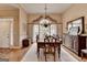 Inviting dining area boasting natural light, hardwood floors, and traditional decor at 3230 Riverhill Ct, Cumming, GA 30041
