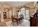 Bright dining room area showcasing a large window and hardwood flooring at 3230 Riverhill Ct, Cumming, GA 30041