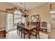 Bright dining room with large window, beautiful chandelier and hardwood floors at 3230 Riverhill Ct, Cumming, GA 30041
