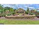 Stone entrance sign for the Chattahoochee River Club surrounded by colorful flowers and manicured landscaping at 3230 Riverhill Ct, Cumming, GA 30041