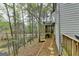 Exterior view of home beside wooded pond area at 3230 Riverhill Ct, Cumming, GA 30041
