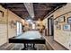 Spacious game room with a pool table, exposed beams, and wood-paneled walls at 3230 Riverhill Ct, Cumming, GA 30041