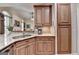 Lovely kitchen with granite countertops, light wood cabinets, and a stainless steel sink at 3230 Riverhill Ct, Cumming, GA 30041