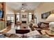 Comfortable living room features fireplace, hardwood floors, and an open layout at 3230 Riverhill Ct, Cumming, GA 30041