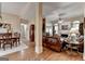 Open concept living room showcasing fireplace, hardwood floors, and comfortable furnishings at 3230 Riverhill Ct, Cumming, GA 30041
