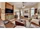 Inviting living room featuring a fireplace, hardwood floors, and rustic wood accents at 3230 Riverhill Ct, Cumming, GA 30041