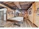 Recreation room features a pool table, stairs, an exposed wood ceiling, and knotty pine planking at 3230 Riverhill Ct, Cumming, GA 30041