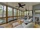 Large screened porch offering a view of the woods at 3230 Riverhill Ct, Cumming, GA 30041