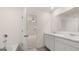 Bathroom featuring double sink vanity with marble countertops, a bathtub, and neutral wall paint at 8593 Secretariat Dr # 20, Lithonia, GA 30058