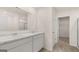 Bathroom featuring double sink vanity with marble countertops and a walk-in closet at 8593 Secretariat Dr # 20, Lithonia, GA 30058