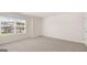 Carpeted bedroom featuring natural light and white trim at 8593 Secretariat Dr # 20, Lithonia, GA 30058