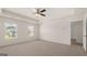 Spacious bedroom with carpet flooring, ceiling fan, and natural light at 8593 Secretariat Dr # 20, Lithonia, GA 30058