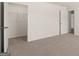 Bedroom featuring neutral carpet, white trim and closet space at 8593 Secretariat Dr # 20, Lithonia, GA 30058