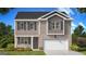 Two-story home featuring brick and siding exterior, dark shutters, and an attached garage at 8593 Secretariat Dr # 20, Lithonia, GA 30058