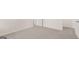 Carpeted hallway featuring white walls and trim at 8593 Secretariat Dr # 20, Lithonia, GA 30058