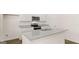 Modern kitchen with white cabinets, granite countertops, stainless steel appliances and island sink at 8593 Secretariat Dr # 20, Lithonia, GA 30058