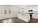 Modern kitchen with white cabinets, granite countertops, stainless steel appliances, and wood floors at 8593 Secretariat Dr # 20, Lithonia, GA 30058
