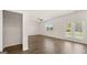 Living room with hardwood floors, a closet, and a sliding glass door that provides lots of natural light at 8593 Secretariat Dr # 20, Lithonia, GA 30058